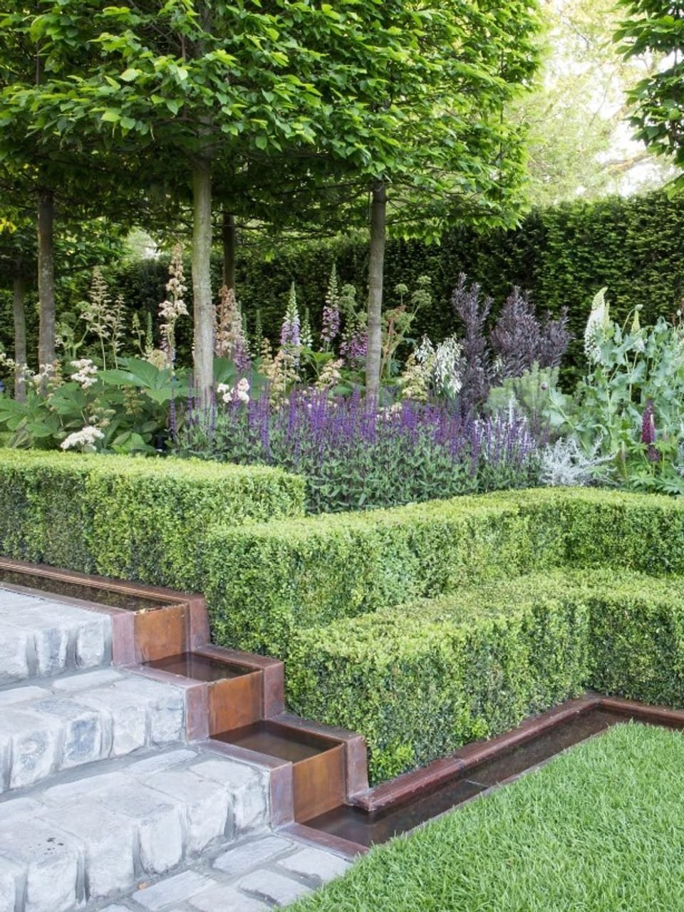Formal landscaped garden with hedges and planting